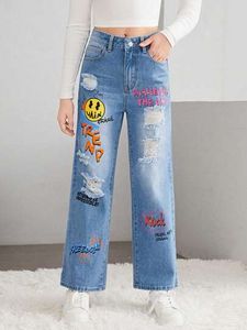Oferta de SHEIN Chicas adolescentes Jeans de pierna recta con estampado de slogan y dibujos animados desgarro por $13410 en Shein