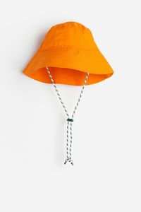 Oferta de Sombrero bucket con cordón ajustable por $6993 en H&M